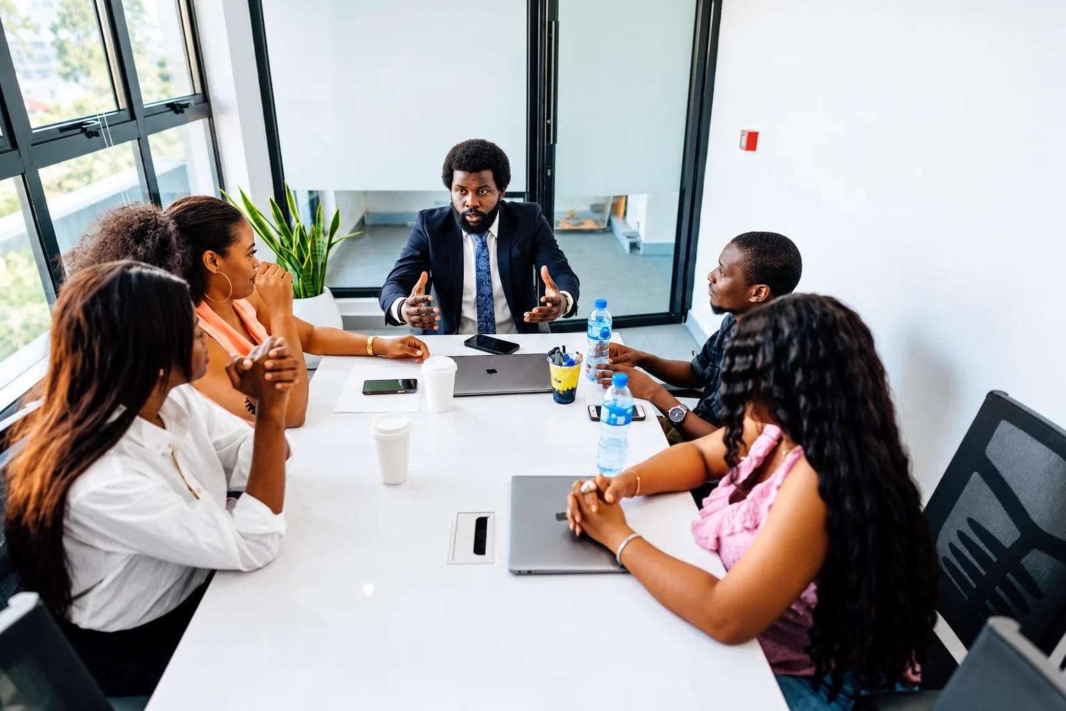 Team discussing a project around a conference table